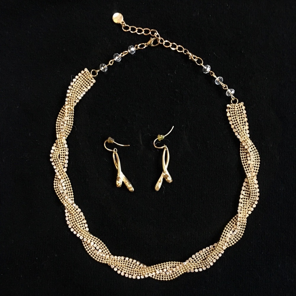 Gold and rhinestone necklace and earring set.